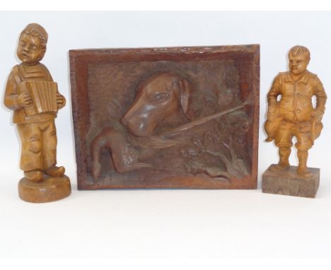 RUSTIC DEEP CARVED GUN DOG WITH GAME PANEL and two standing figurines of a young boy with accordion and a bearded man holding