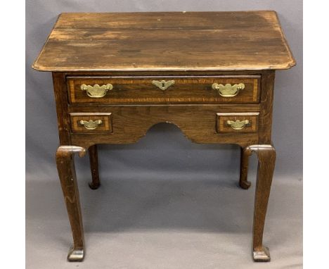VINTAGE OAK LOWBOY - having a shaped top over one long and two short crossbanded drawers with replacement brassware, central 