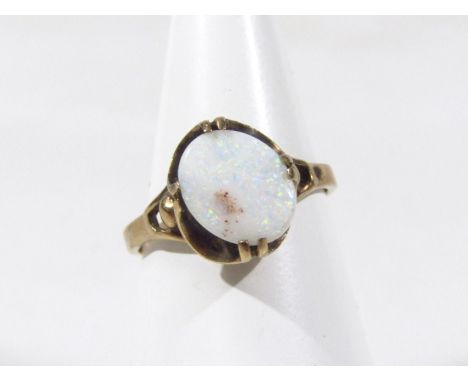 A ladies dress ring, claw set with opal coloured stone, marked .375, 2.2g all in, size N.