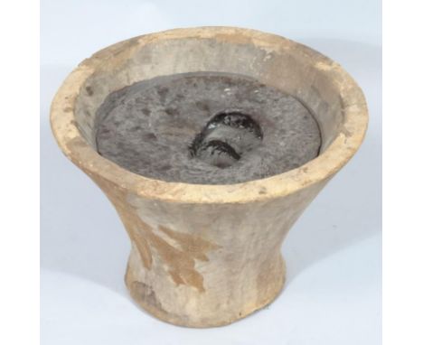 A carved inverted planter or plinth, of shaped circular outline, 33cm high, 44cm diameter.