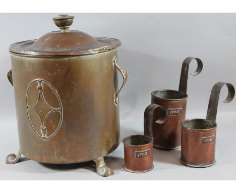 An early 20thC brass coal box, of cylindrical outline, with lift off lid and (removable) interior, on scroll feet, 24cm high 
