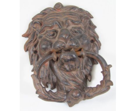 A 20thC cast metal door knocker, with oval leafy articulated handle, 20cm high. 