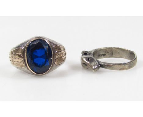 A silver dog ring, marked SILVER, size M-N,  and a two coloured college style ring with blue centre. (2)