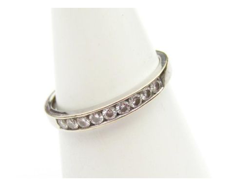 A ladies 18ct white gold half eternity ring, set with .25 ct of diamonds, size N.