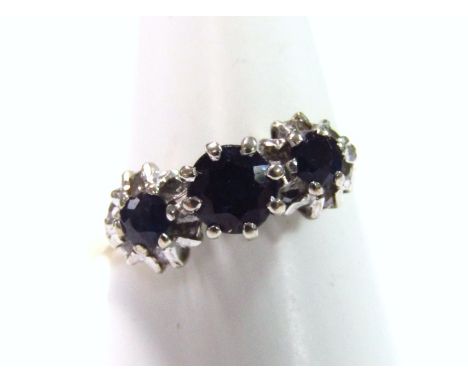 An 18ct gold sapphire and diamond ring, size K, hallmarked 1973.