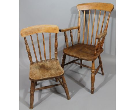 An early 20thC stripped ash and elm kitchen chair, with plain spoke back, shaped arms and ring turned front supports joined b