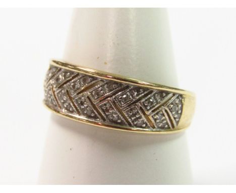 A 15ct dress ring, set with small white stones, marked 585, size S, 3.3g all in.