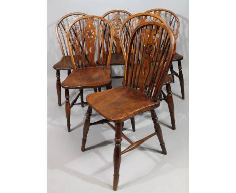 A harlequin set of six late 19thC ash and elm wheel back kitchen chairs, with hoop tops, stick backs, single turned front rin