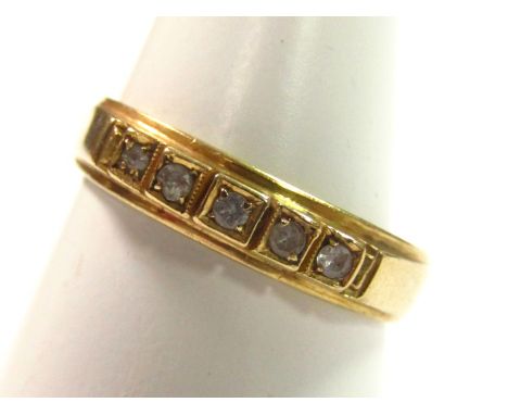 A five stone half eternity ring, size L, stamped 750.