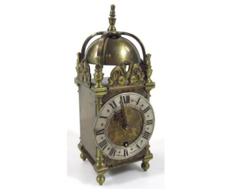 A mid 20thC Asprey brass lantern clock, with domed bell top, the 4cm dia. Roman numeric chapter ring and key wind movement wi