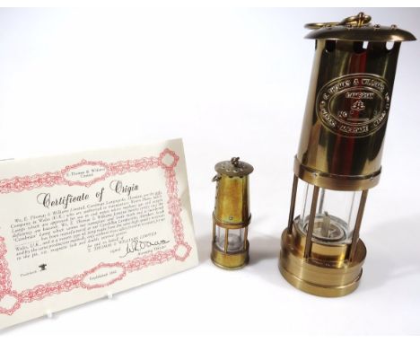 A modern brass Cambrian miner's lamp, by Thomas & Williams, no. 82019, with 'S' shaped handle, the main body, 27cm high, and 