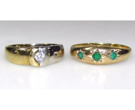 An emerald three stone ring, size P and diamond single stone ring, in a bi-colour setting, marked 9K 375. (2)
