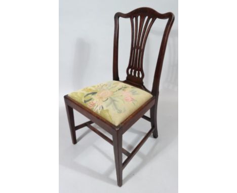 An Edwardian mahogany Chippendale revival chair, with inverted pierced back splat and drop in seat in floral petit point styl