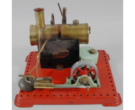 A 20thC Mamod stationary engine SP4, on red metal base, 21cm wide.