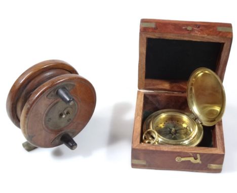 A polished wooden fishing reel, with metal mounts and articulated centre, 10cm wide, and a modern compass in box, centred by 