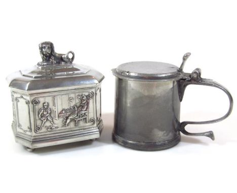 A BPC Tor pewter tankard, lid with thumb scroll handle, revealing plain interior, with an 'S' scroll side handle, 15cm high, 