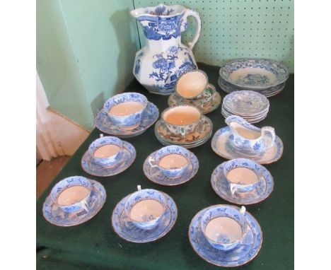 A collection of blue and white china, to include: six cups & saucers, sugar bowl, large water jug and other china.