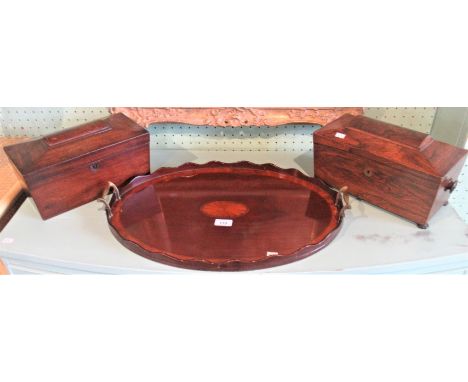 An Edwardian oval mahogany and shell inlaid drinks tray, together with a 19th century rosewood sarcophagus tea caddy and anot