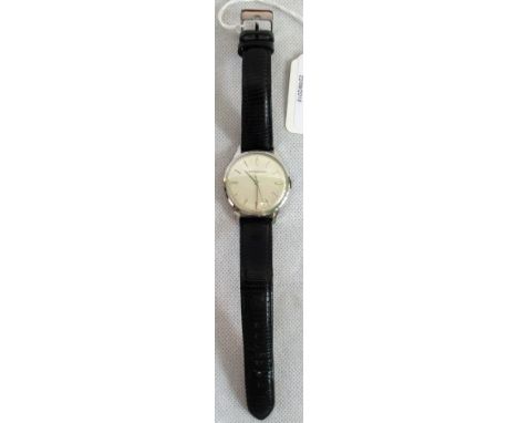 Jaeger-LeCoultre.  A gents automatic wristwatch, the face with baton decoration and the back bearing the no. 874803.   Condit