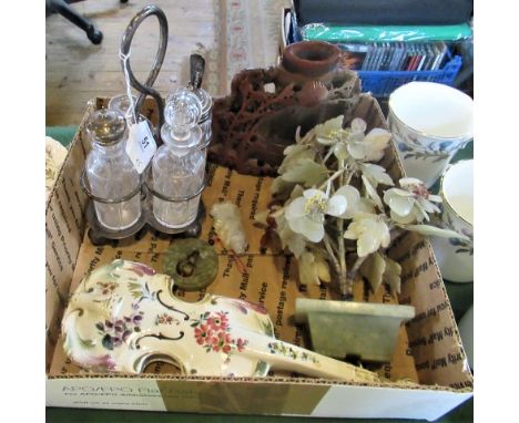 A box containing a four piece cruet set, soapstone ornament, jade flower ornaments and other items.