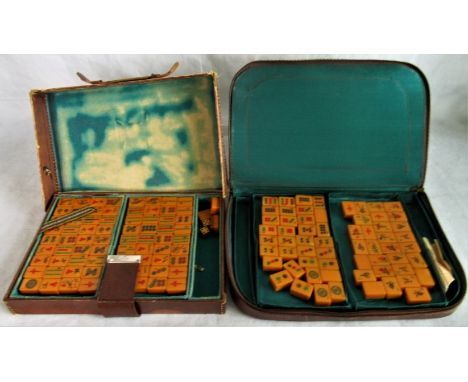 Two cased Mahjong sets.