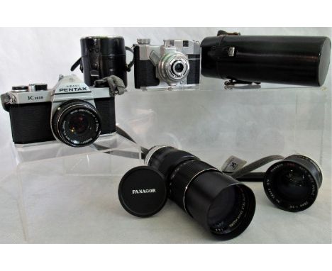 A Pentax camera K1000, together with a Koroll camera and two Panagor lenses.