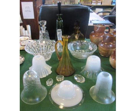 A quantity of miscellaneous glassware, to include: three decanters, two fruit bowls, lamp shades and other related items.
