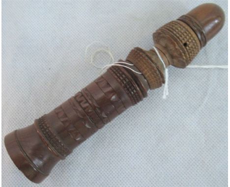 A treen sewing mate in the form of a decorated domed pillar, the internal containing thread reels and a silver thimble.