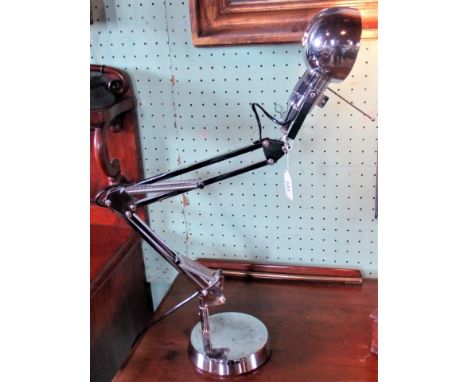 A contemporary chrome angle poise lamp. 