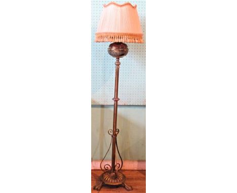 A Victorian brass standard lamp.