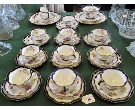 A Victorian part-Crescent Ware tea service, with flower decoration, gilt and blue border, comprising: ten trios, two cake pla