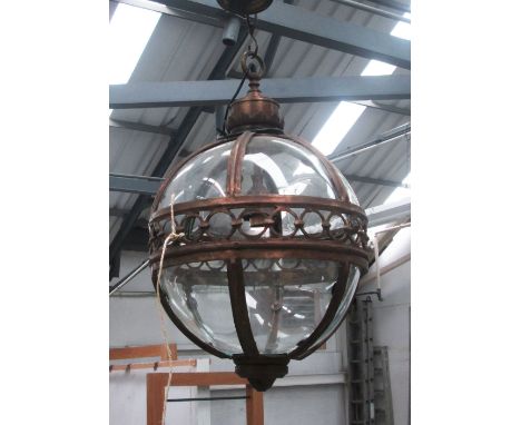 HANGING LANTERN, globe form in a bronzed metal frame, 51cm diam plus chain.