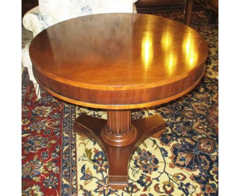 RALPH LAUREN LAMP TABLE, circular mahogany with fluted column, 67cm W x 69cm H.