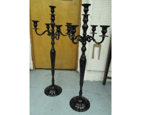 CANDELABRA, a pair, in black, five branch and floorstanding, 100cm H. (2)