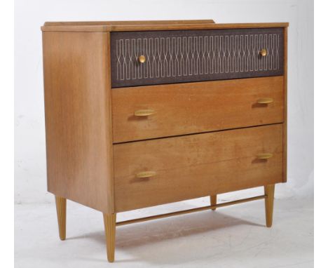 Mid Century Lebus chest of three drawers in oak from their Link range. The top drawer has a unique pattern to the front and d