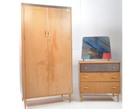 Mid Century Lebus dressing chest of three drawers in oak, with mirror above, from their Link range. The top drawer has a uniq