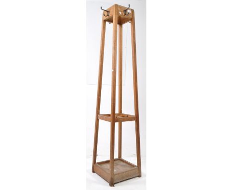 A vintage 20th century oak hall coat stand. Square tapering form with metal coat hooks, four upright supports with stick / um