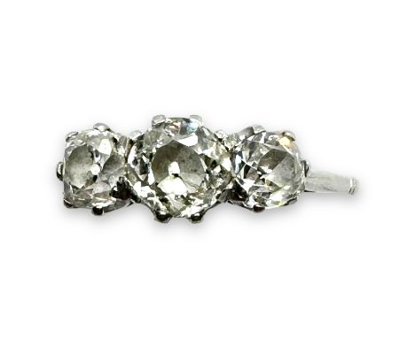 An early 20th century diamond three stone ring set with three Old Mine cut diamonds. The central stone measures an average ap