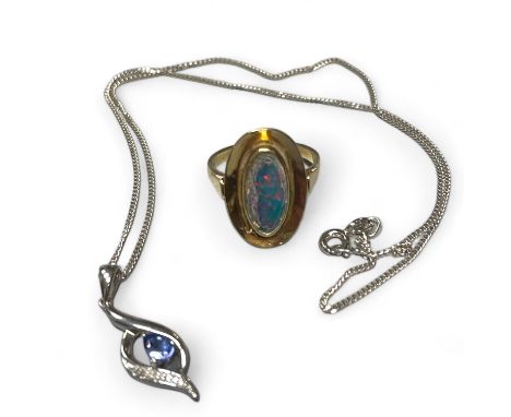 A diamond and tanzanite set 9ct white gold pendant and chain, together with an opal dress ring. The ring is stamped "9ct" to 