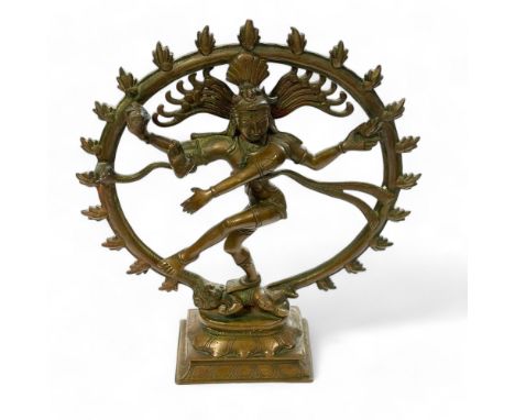 A bronze Indian Figure of Shiva Nataraja dancing within a flaming halo.  25cm  x 30cm high