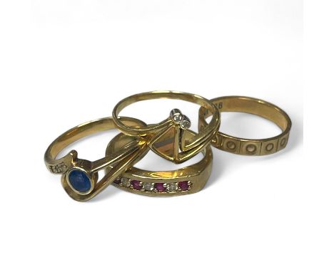 A collection of dress rings in gold. Comprising a 9ct gold ruby and diamond half eternity ring, size L; a "9ct" stamped beade