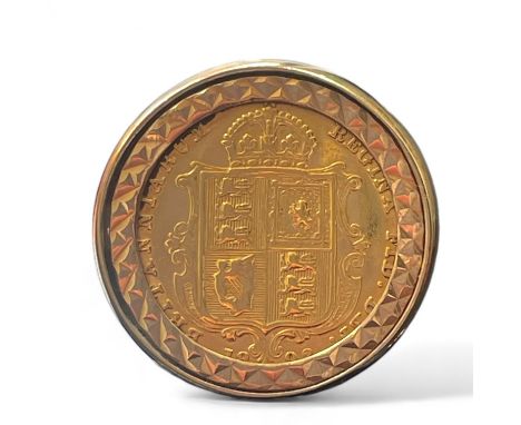 An 1892 "shield back" Victoria half sovereign, set into a clip mount 9ct gold ring. Size M. Gross weight approximately 9.54 g