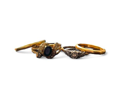 A collection of four dress rings. Comprising two 22ct gold band rings (one with rubbed hallmarks), sizes M &amp; J1/2; a diam