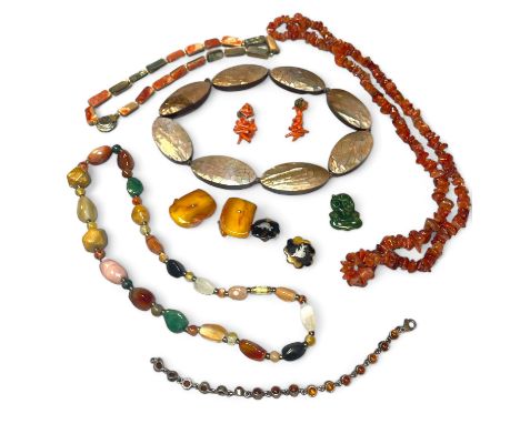 A collection of shell, amber and tortoiseshell jewellery. To include a pair of coral ear clips; a pair of silver pique tortoi