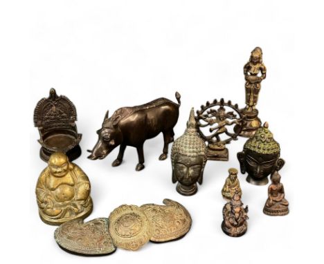 A collection of Asian bronze and brass items, to include Tibetan Buddhas, a bronze boar and a possibly Ottoman belt buckle, e