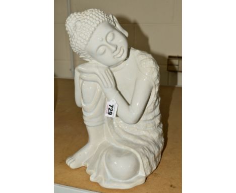 A MODERN CERAMIC SCULPTURE OF A SEATED BUDDHA in a white glaze, approximate height 34cm