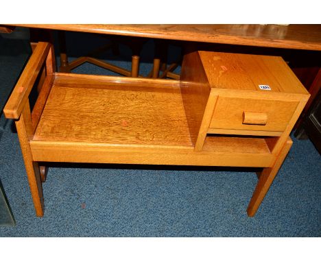 A LIGHT OAK TELEPHONE TABLE with a single drawer