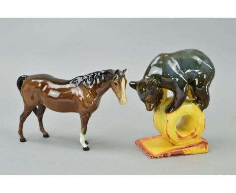 A USSR KONAKOVO CERAMIC STUDY, of bear balanced on wheel, approximate height 15cm together with a Beswick Mare (facing right)