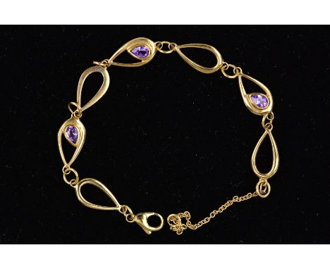 A MODERN 9CT GOLD AMETHYST LINK BRACELET, open pear shape link with alternating amethyst rub over set, measuring approximatel