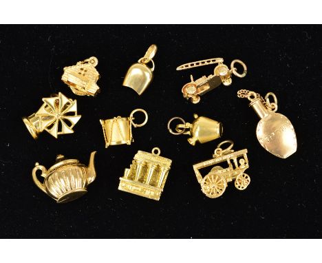 TEN MAINLY GOLD LOOSE CHARMS to include a windmill stamped 750, a vintage fire engine with 9ct hallmark and a drum with 9ct g